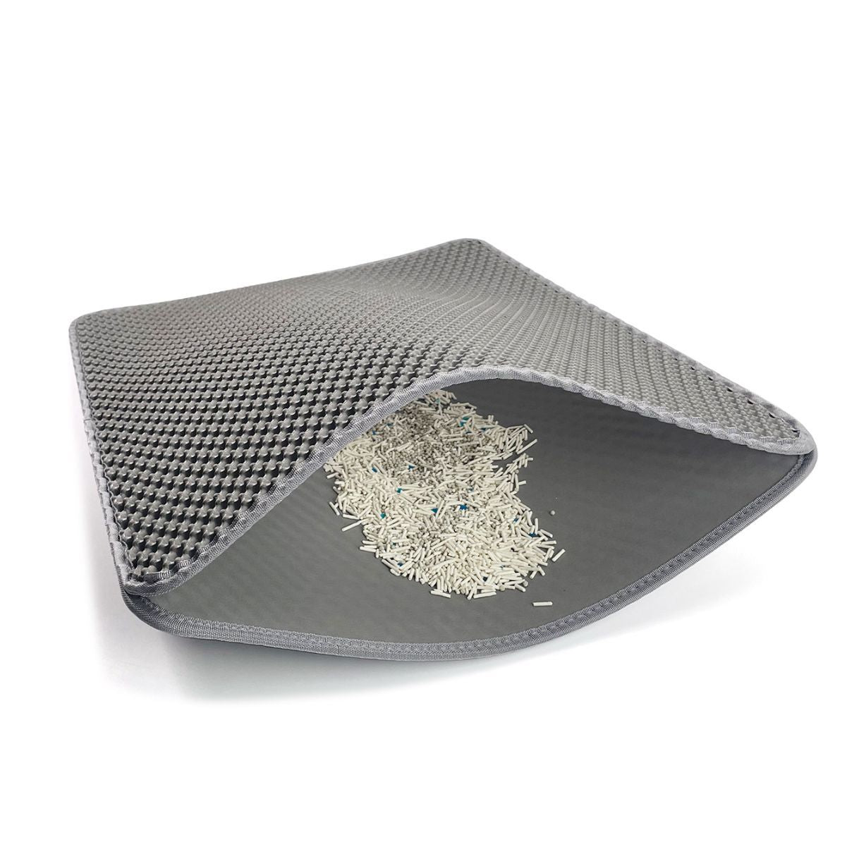 Gray pet mat with a textured top layer and smooth bottom layer on a white background